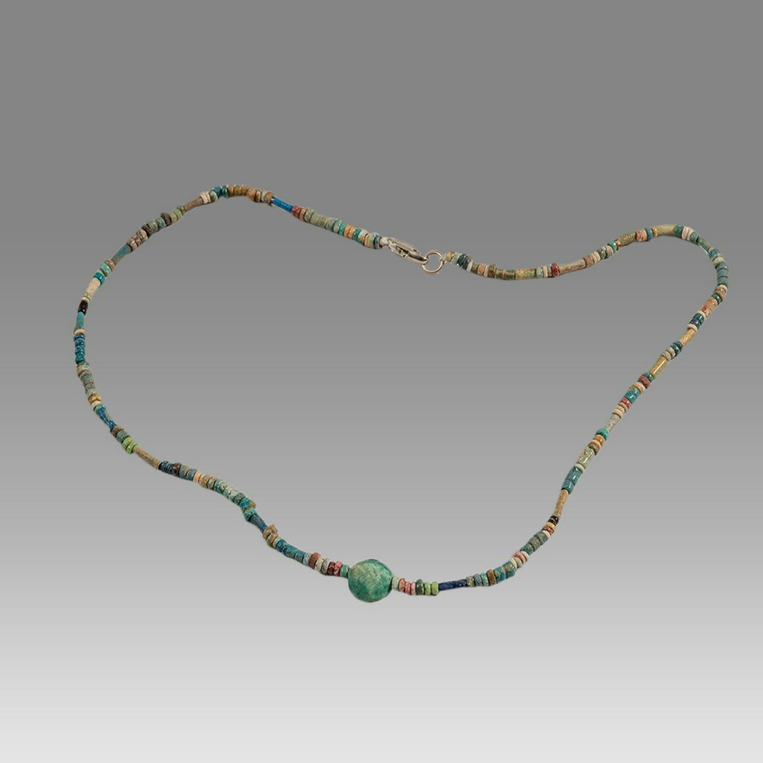 Ancient Egyptian Faience Bead Necklace With Scarab c.300-50 BC.: Ancient Egyptian Faience Bead Necklace With Scarab c.300-50 BC. Size 17 3/8 inches length. Great Looking single strand Faience Bead necklace, with button scarab late period 300-50 BC. wearable. Proven