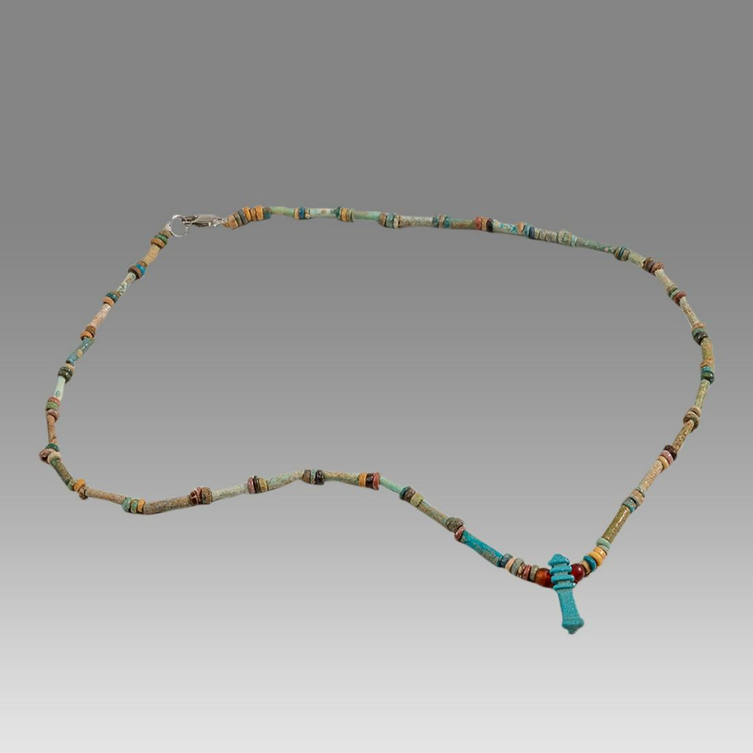 Ancient Egyptian Faience Bead Necklace with Amulet c.300-50 BC.: Ancient Egyptian Faience Bead Necklace with Amulet c.300-50 BC. Size 18 3/4 inches length. Great Looking single strand Faience Bead necklace with blue faience Pillar amulet. late period 300-50 BC. wea