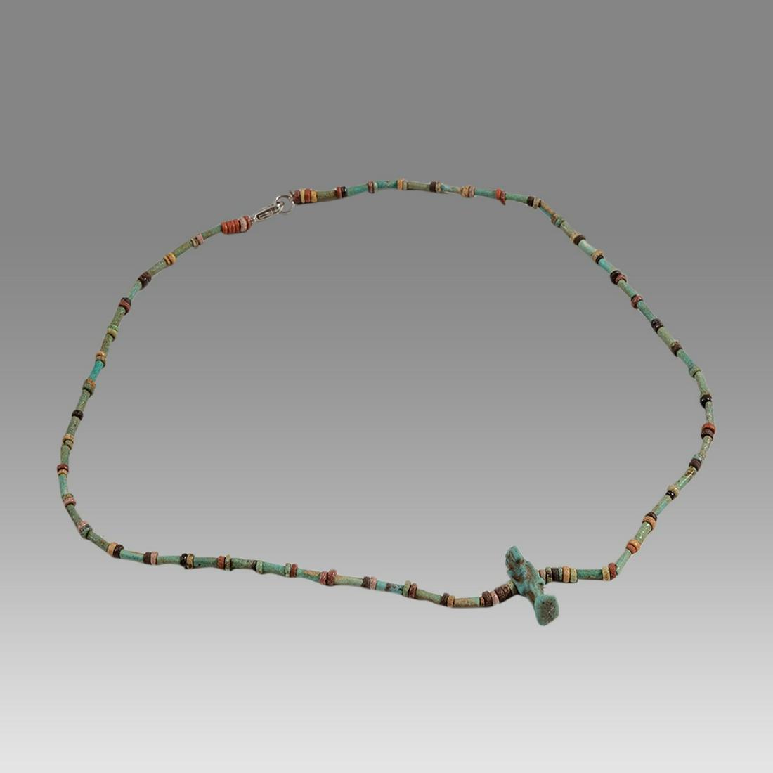 Ancient Egyptian Faience Bead Necklace with Amulet c.300-50 BC.: Ancient Egyptian Faience Bead Necklace with Amulet c.300-50 BC. Size 19 1/8 inches length. Great Looking single strand Faience Bead necklace with blue faience Ibes amulet. late period 300-50 BC. weara