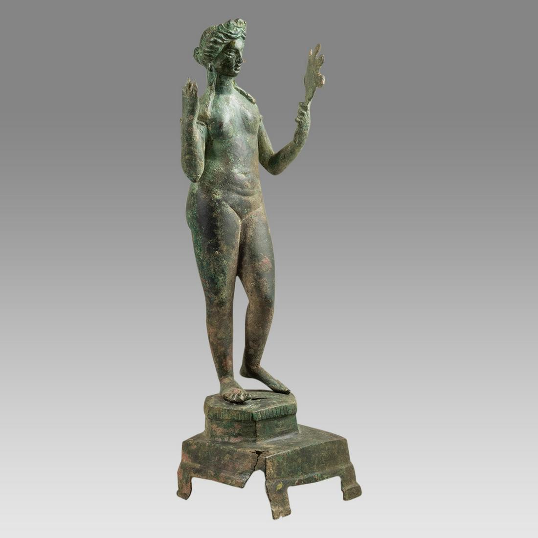 Ancient Large Roman Bronze Figure Of Venus. Ex Christies. c.1st century AD.: Ancient Large Roman Bronze Figure Of Venus. Ex Christies. c.1st century AD. Size 12 5/8 inches high ( 32.2 cm) The goddess standing naked, her left leg flexed admiring herself in a mirror held in her 