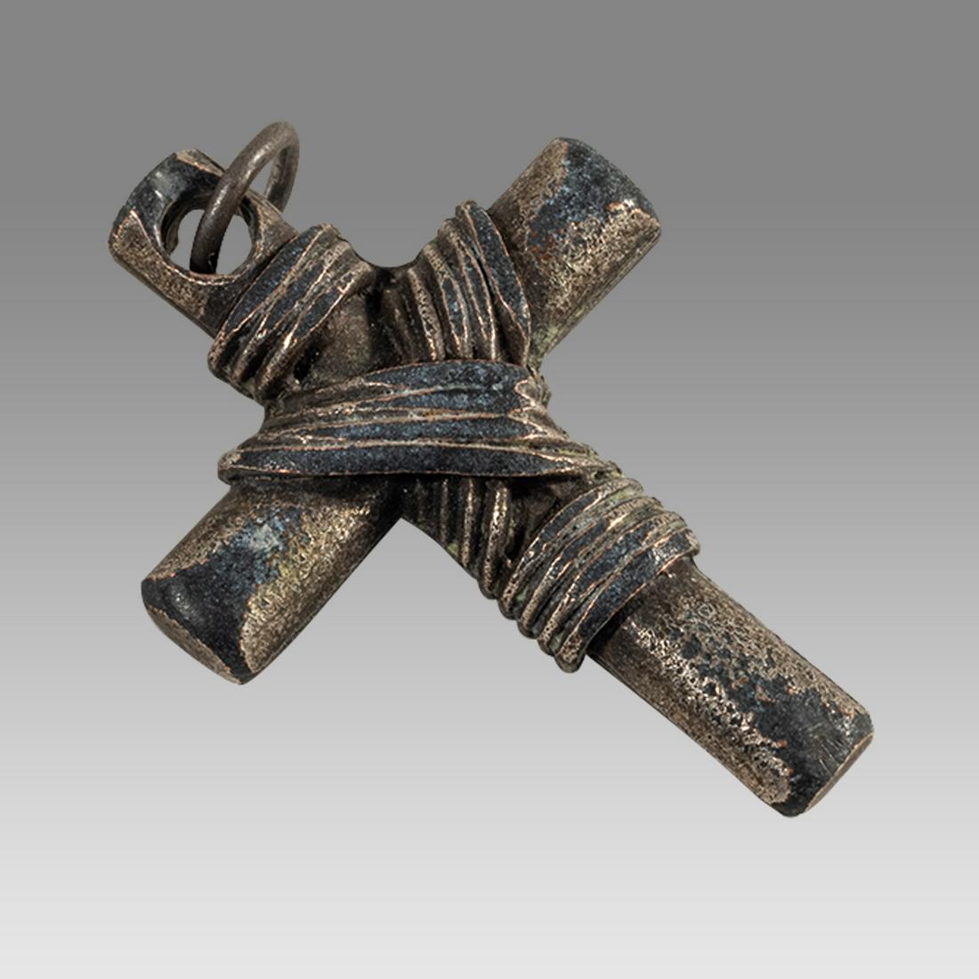 European Silver Cross c.17th century.: European Silver Cross c.17th century. Size 1 1/4 x 0 3/4 inches. Unusual solid silver cross with wires wrapped around. suspension loop. Dark patina. Ex CA Collection.