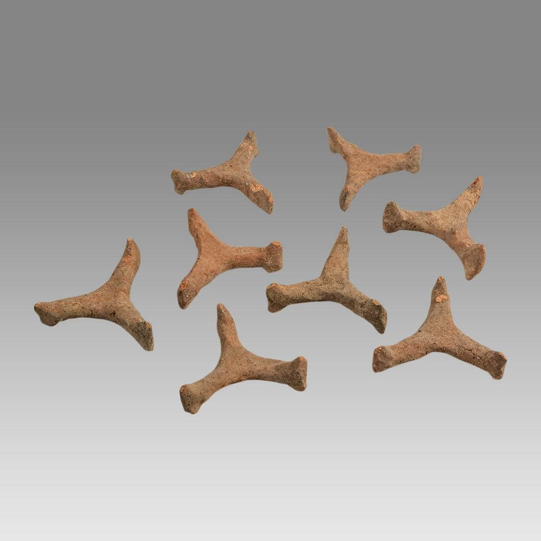 Lot of 8 Ancient Pre Columbian Clay bowl stands Ca. 600 to 900 AD.: Lot of 8 Ancient Pre Columbian Clay bowl stands Ca. 600 to 900 AD. Size 3 1/4 inches length. A collection of 8 clay stands for bowls or vessels?. Provenance: Ex Dr. Laurence Stuart collection, profess