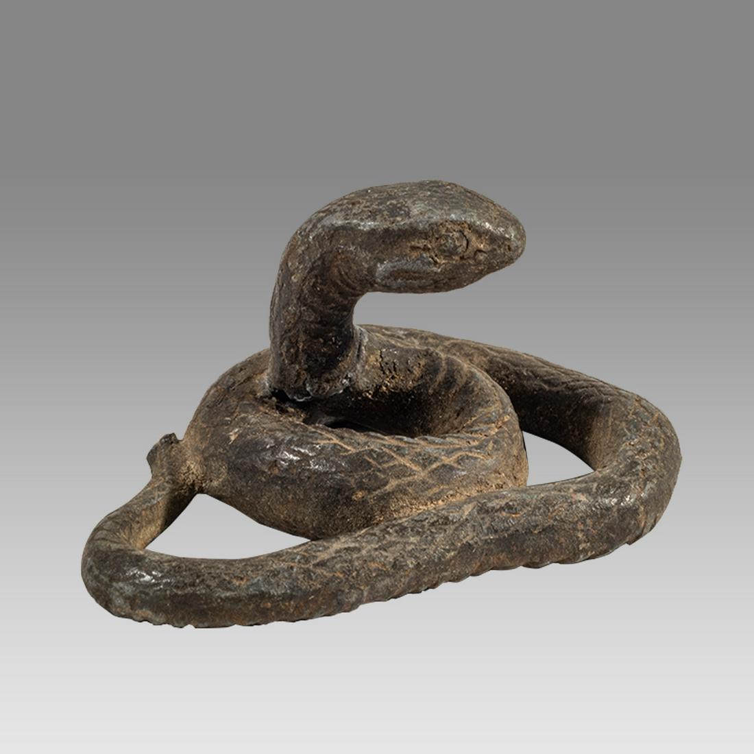 Egyptian Bronze Snake. probably ancient.: Egyptian Bronze Snake. probably ancient. Size 2 inches wide, 1 inch high. Solid cast bronze snake Cobra. Patina cleaned. hard to tell authenticity? Provenance: Ex Peter Alexander Ruthven collection, w