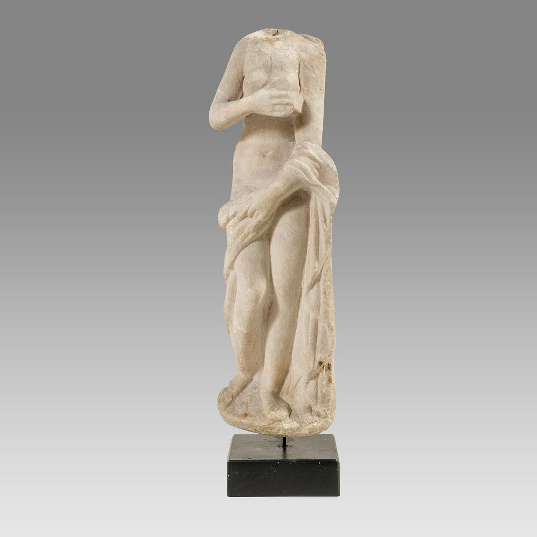 Ancient Roman Marble Figure of Venus c.2nd century AD.: Ancient Roman Marble Figure of Venus c.2nd century AD. Size 14 1/2 inches high + mount. standing naked, her right hand resting on her breast, draped around her lower body and falling from her left low