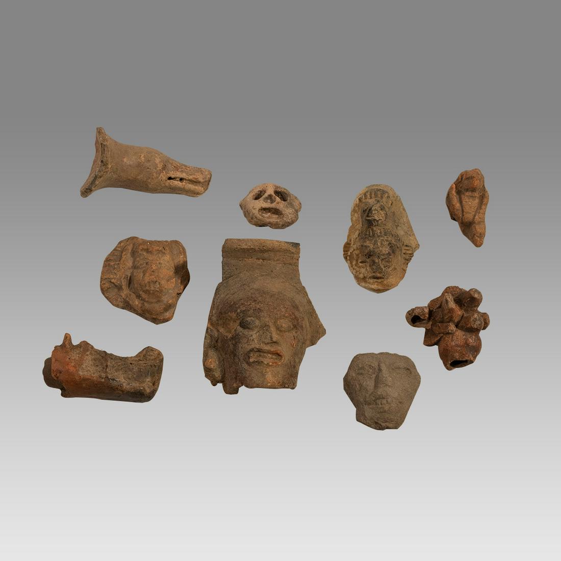Ancient Pre Columbian Mayan Heads, Ca. 600 to 900 AD.(9): Ancient Pre Columbian Mayan Heads, Ca. 600 to 900 AD.(9) Size 2 - 4 3/4 inches length. A collection of 9 pottery heads, fragments from full figures. Provenance: Ex Dr. Laurence Stuart collection, prof