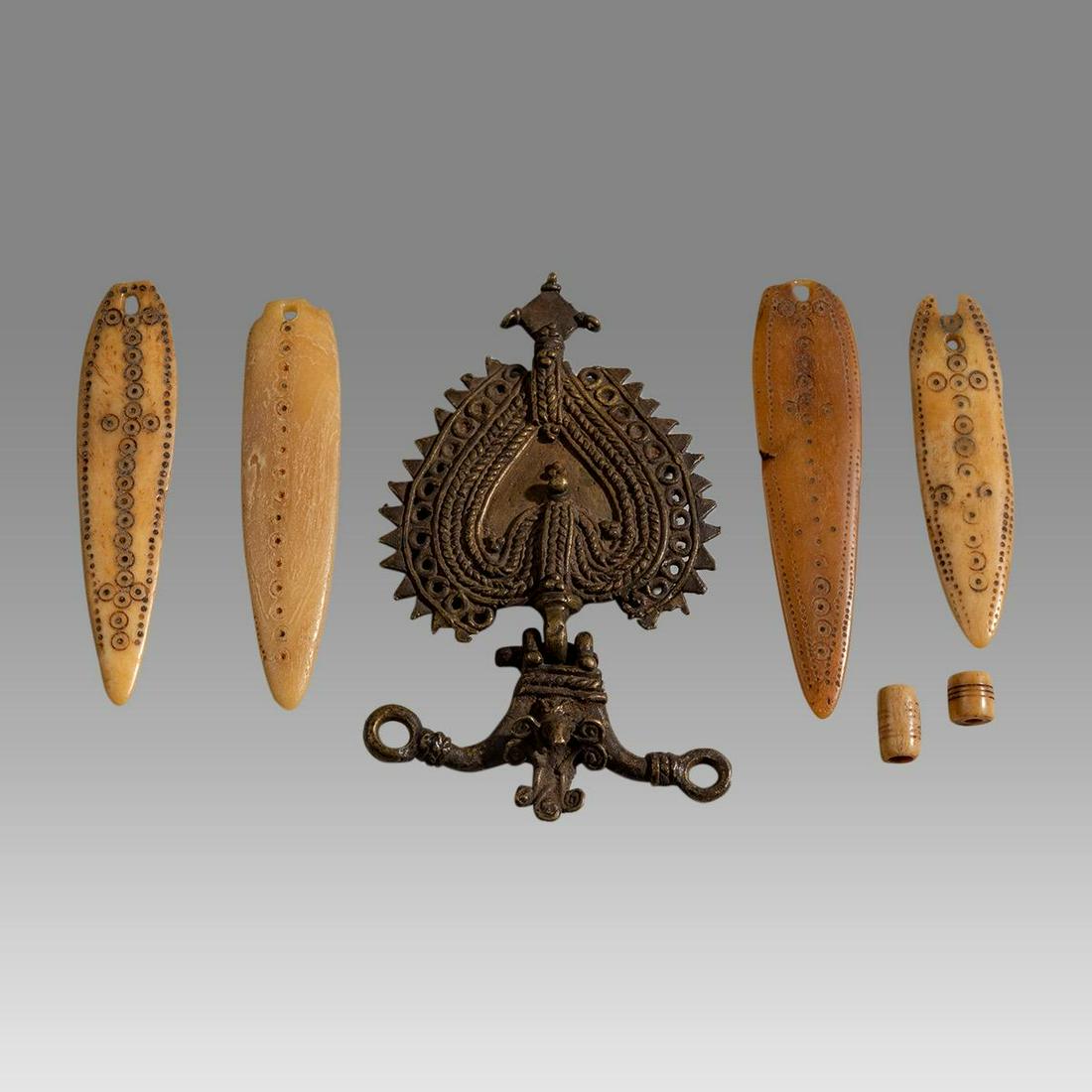 19th century Indian Brass Latch and Pendants (7).: 19th century Indian Brass Latch and Pendants (7). Size 0 1/4 - 5 1/2 inches length. Including an Indian cast brass box latch having an abstract figural upper portion and a heart shape lower portion, r