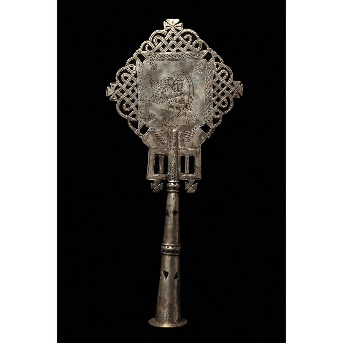 Ethiopian Coptic Processional Cross Ca. 20th century.: Ethiopian Coptic Processional Cross Ca. 20th century. Size 15 1/2 x 7 inches Low grade silver processional cross having openwirk and geometric designs. Main scene is an incised image of the Trinity, a