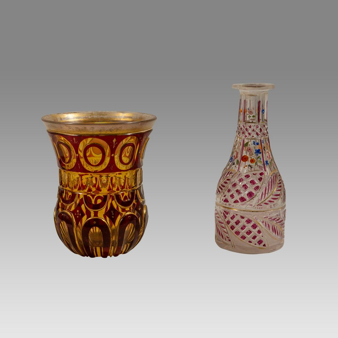 19th cent Bohemian Glass Cup, Decanter made for the middle eastern market.(2).: 19th cent Bohemian Glass Cup, Decanter made for the middle eastern market.(2). Size 5 3/4 - 4 5/8 inches high. A tred bohemian glass cup, together with decanter both with fine enamel decorations.