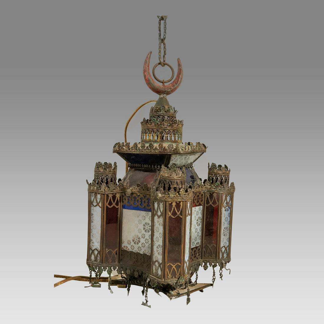 A Middle Eastern Copper Lamp with Glass.: A Middle Eastern Copper Lamp with Glass. Size 14 1/2 inches length + chains. 20th century dark patina copper lamp with glass.