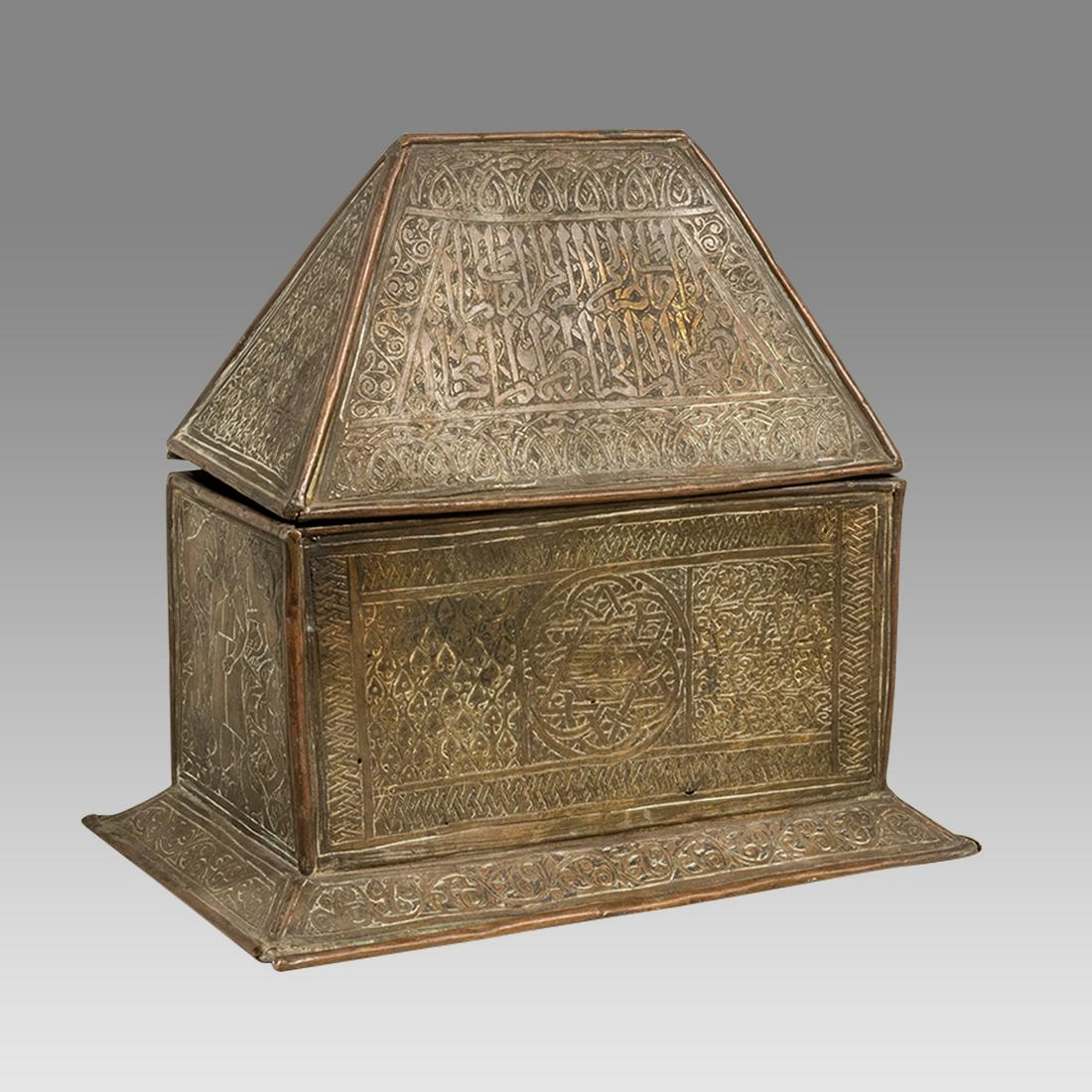 A Middle Eastern Copper Box with Arabic.: A Middle Eastern Copper Box with Arabic. Size 10 1/4 inches high, 10 inches wide. 19th century copper box with unusual shape lid, decorated with engraved Arabic calligraphy.