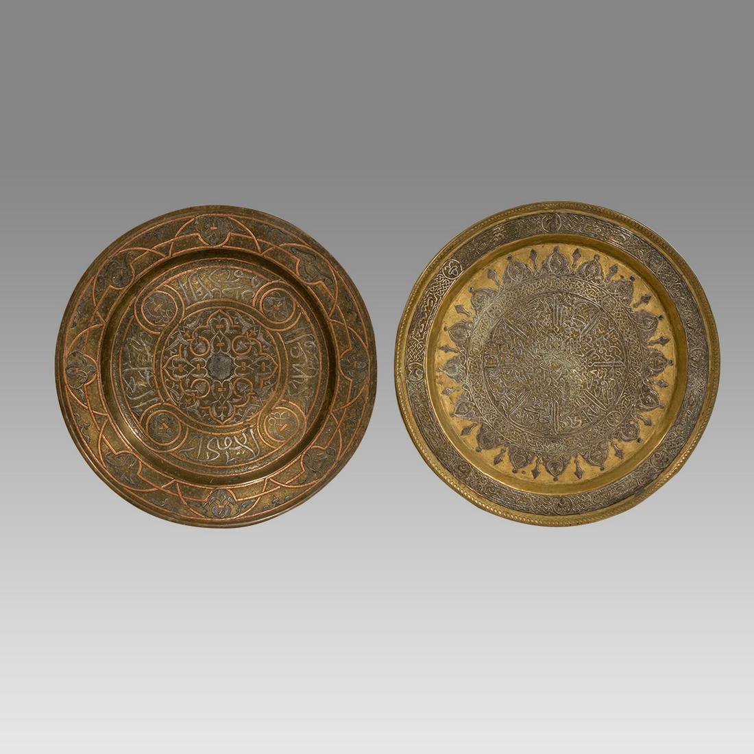 A Middle Eastern Silver Inlaid Brass Trays (2).: A Middle Eastern Silver Inlaid Brass Trays (2). Size 14 inches diameter. 19th century Syrian Brass trays, all with silver inlaid with Arabic calligraphy and floral design.