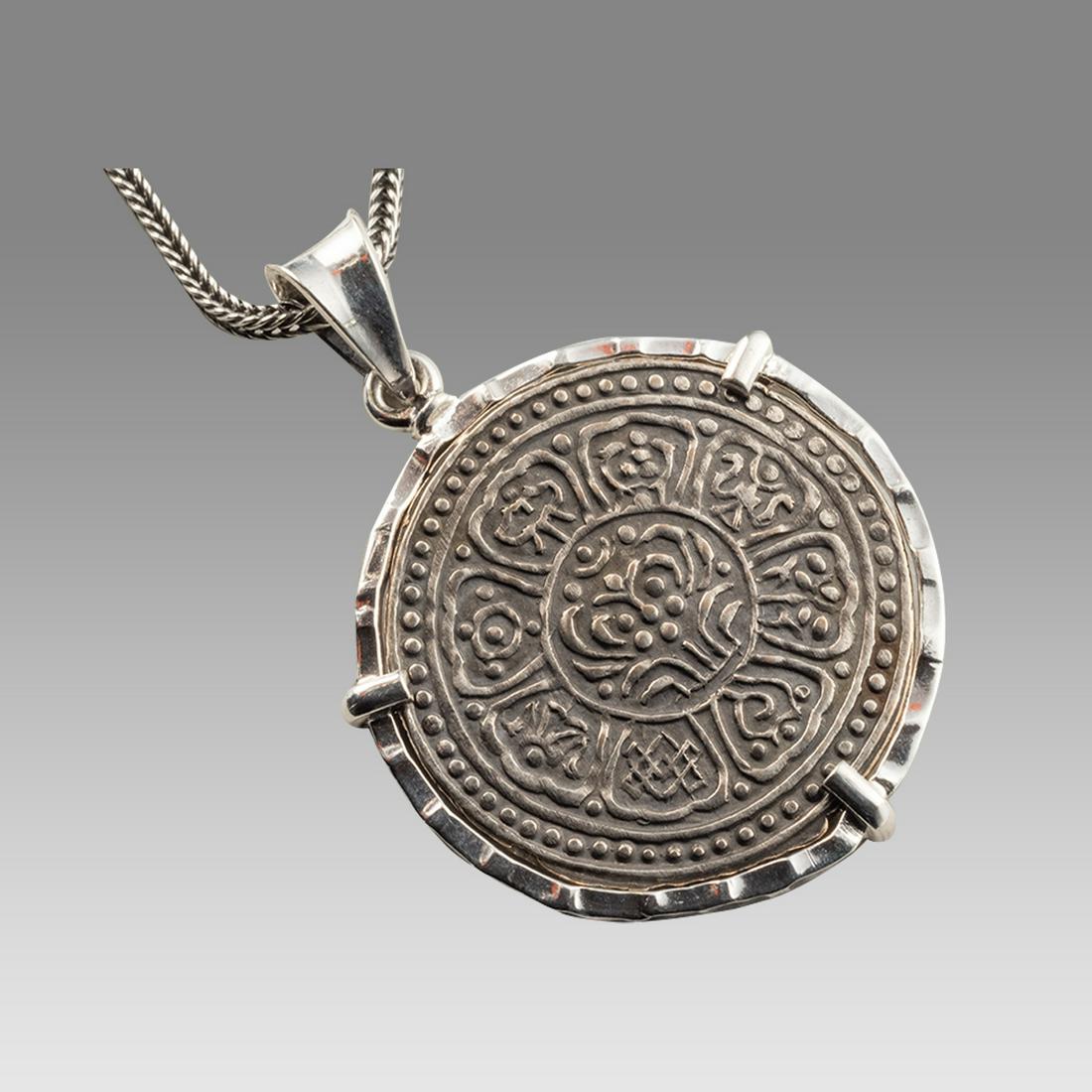 Tibetan Bronze coin set in Silver Necklace 19th Century.: Tibetan Bronze coin set in Silver Necklace 19th Century. Fine condition. The coin is authentic set in Modern Silver necklace. wearable. Size 16 1/4 inches length, bezel 30 mm wide.