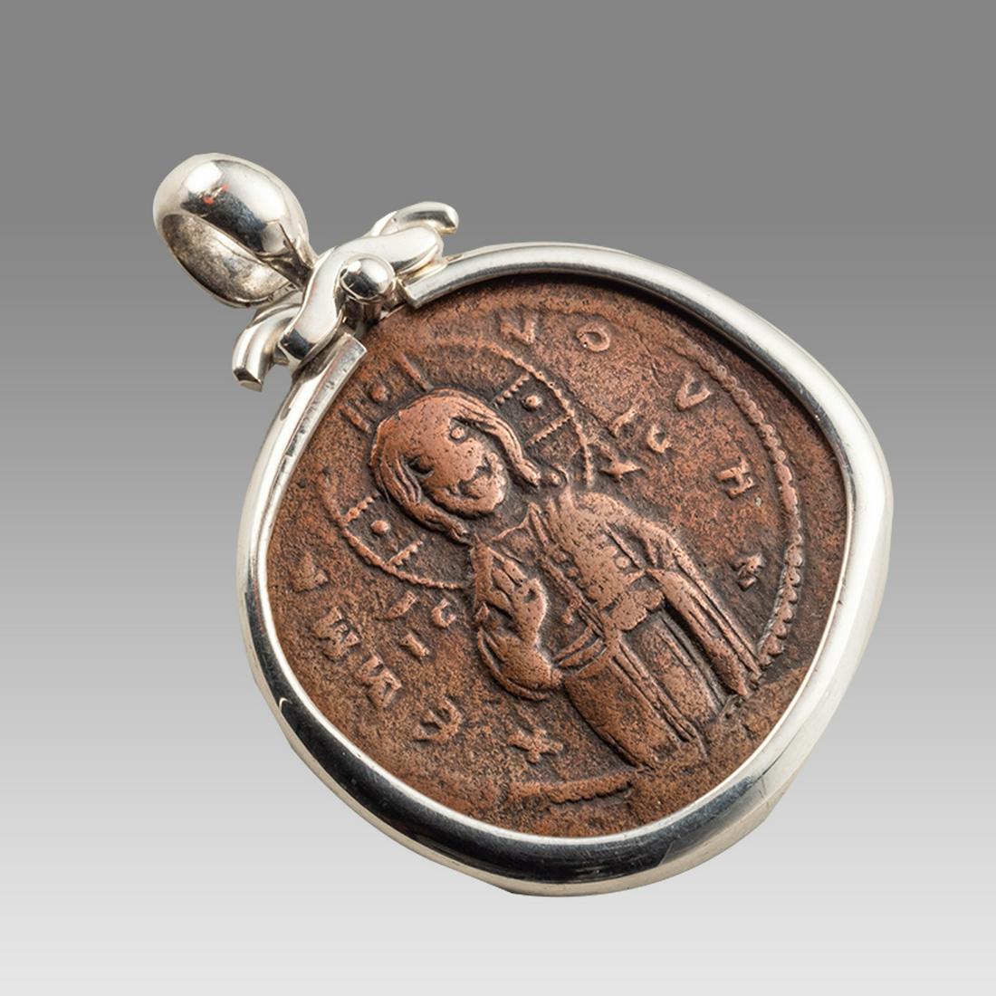 Ancient Byzantine Bronze Coin Of Christ c.1082 AD.: Ancient Byzantine Bronze Coin Of Christ c.1082 AD. Size 1 3/8 inches diameter. Ancient Byzantine Bronze Coin with Christ /Reverse Cross in center with Latin inscriptions. Set in modern Silver Pendant.
