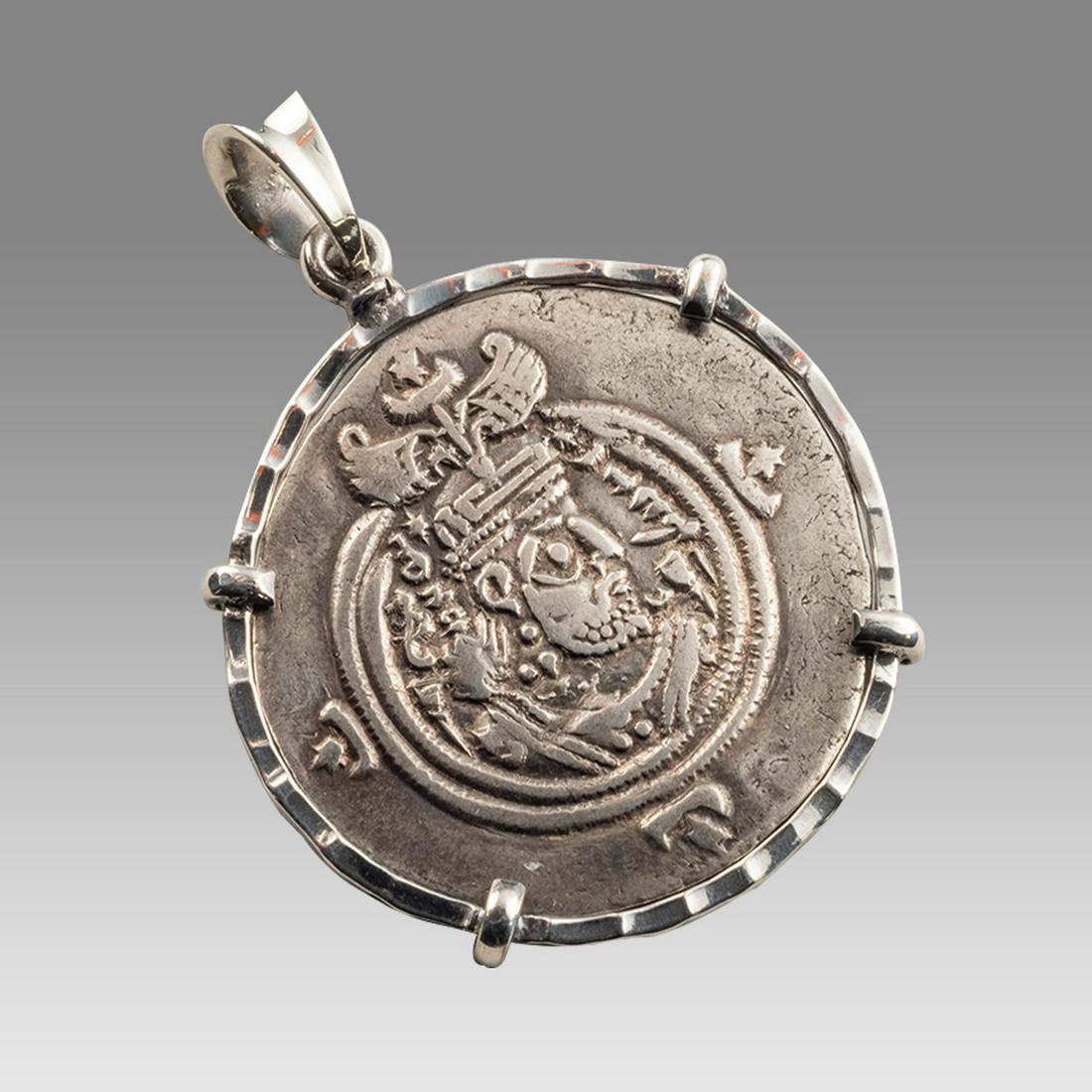 Ancient Sasian Silver coin set in Silver Pendant 505 AD.: Ancient Sasian Silver coin set in Silver Pendant 505 AD. Very Fine condition. The coin is authentic set in Modern Silver Pendant. wearable. Size of bezel 35 mm wide.