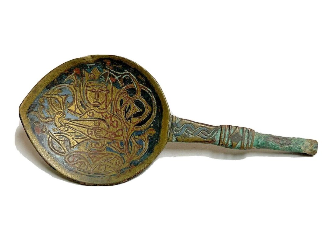 Ancient Islamic Seljuk Bronze Spoon with Musician c.9th century AD.: Ancient Islamic Seljuk Bronze Spoon with Musician c.9th century AD. Size 4 inches length. Cast bronze spoon, decorated with Musician holding musical instrument. Provenance: Private New York collection