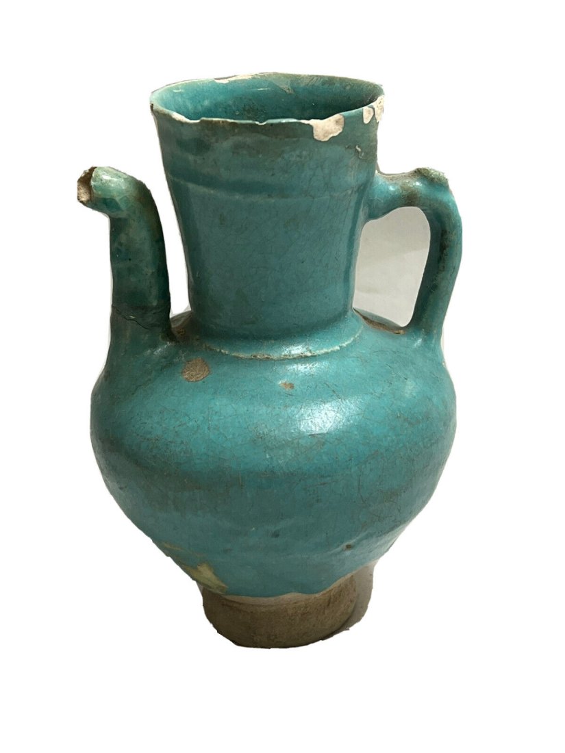 Islamic Persian Kashan, Ceramic Ewer c.14th century.: Islamic Persian Kashan, Ceramic Ewer c.14th century.. Size 5 3/8 inches high. Fine blue glazed ceramic footed ewer. Kashan Persian. Provenance: Private New York collection.