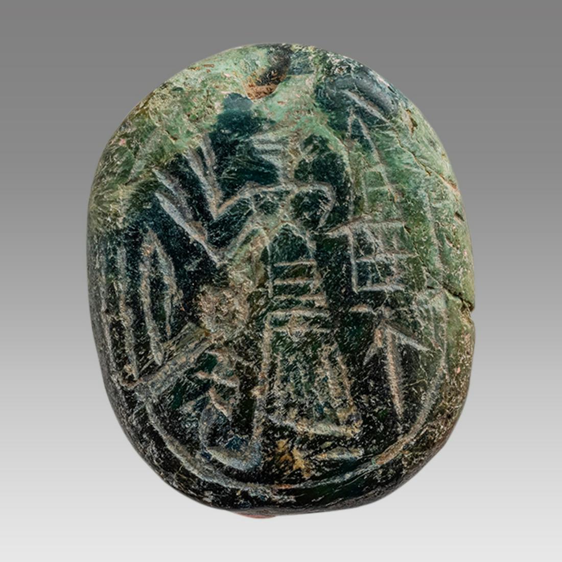 Ancient canaanite scaraboid seal with standing figure late Bronze age c.1200 BC.: Ancient canaanite scaraboid seal with standing figure late Bronze age c.1200 BC. Size 21 x 18 mm. Carved stone scaraboid with standing figure facing left. Provenance: Collection of Mr. and Mrs. Robert