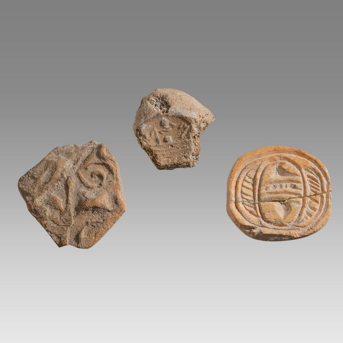 Lot of 3 Ancient Israel Judaea clay, Bone Bulla c.3400-600 BC.: Lot of 3 Ancient Israel Judaea clay, Bone Bulla c.3400-600 BC. Size 18-20 mm. Lot of 2 Clay Bulla together with Bone Hyksos scaraboid. Provenance: Collection of Mr. and Mrs. Robert Feuer, NY., acquire