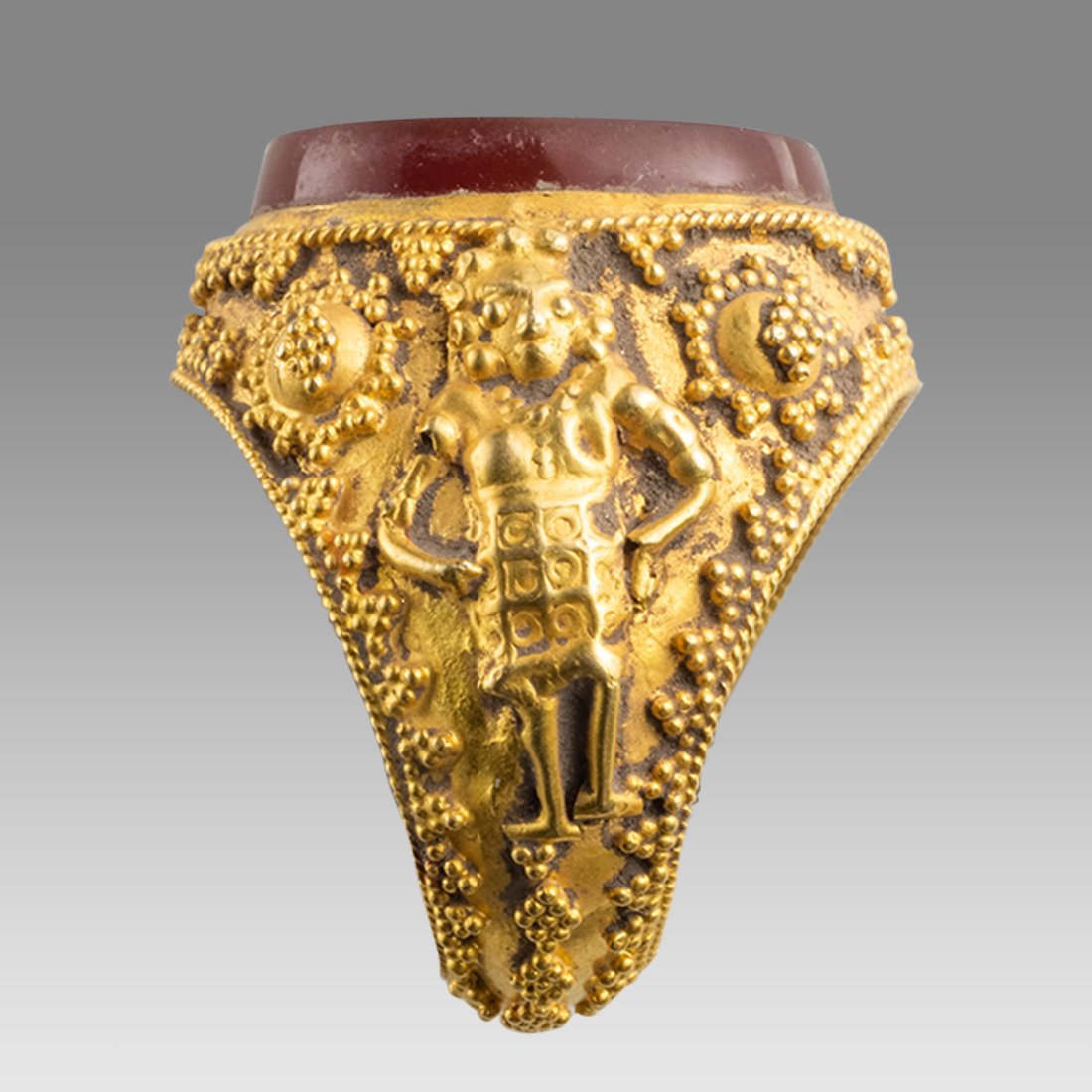 Indo Persian Gold Ring With Intaglio.: Indo Persian Gold Ring With Intaglio. Ring size 7. weight 12.46 grams. High Karat gold ring with Indian diety on each side of the ring. Agate intaglio with Lion standing left. wearable. Ring probably 