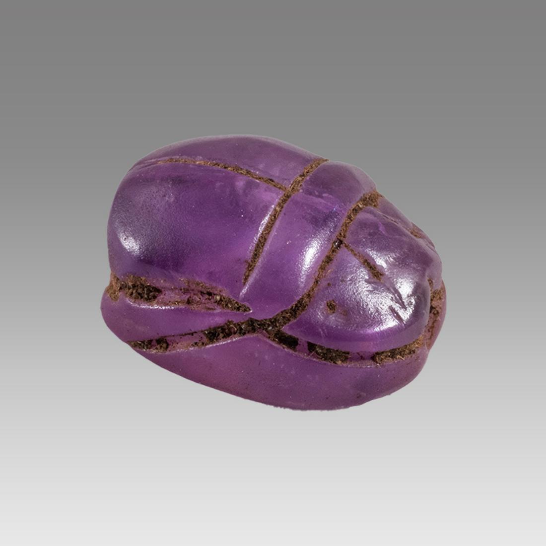 Ancient Roman Egyptian Amethyst Scarab c.2nd century AD.: Ancient Roman Egyptian Amethyst Scarab c.2nd century AD. Size 11 x 10 mm. Unusual Amethyst stone scarab with stealized beatle back. Provenance: Ex Secret Eyes Gallery New York 1970's-1980's.