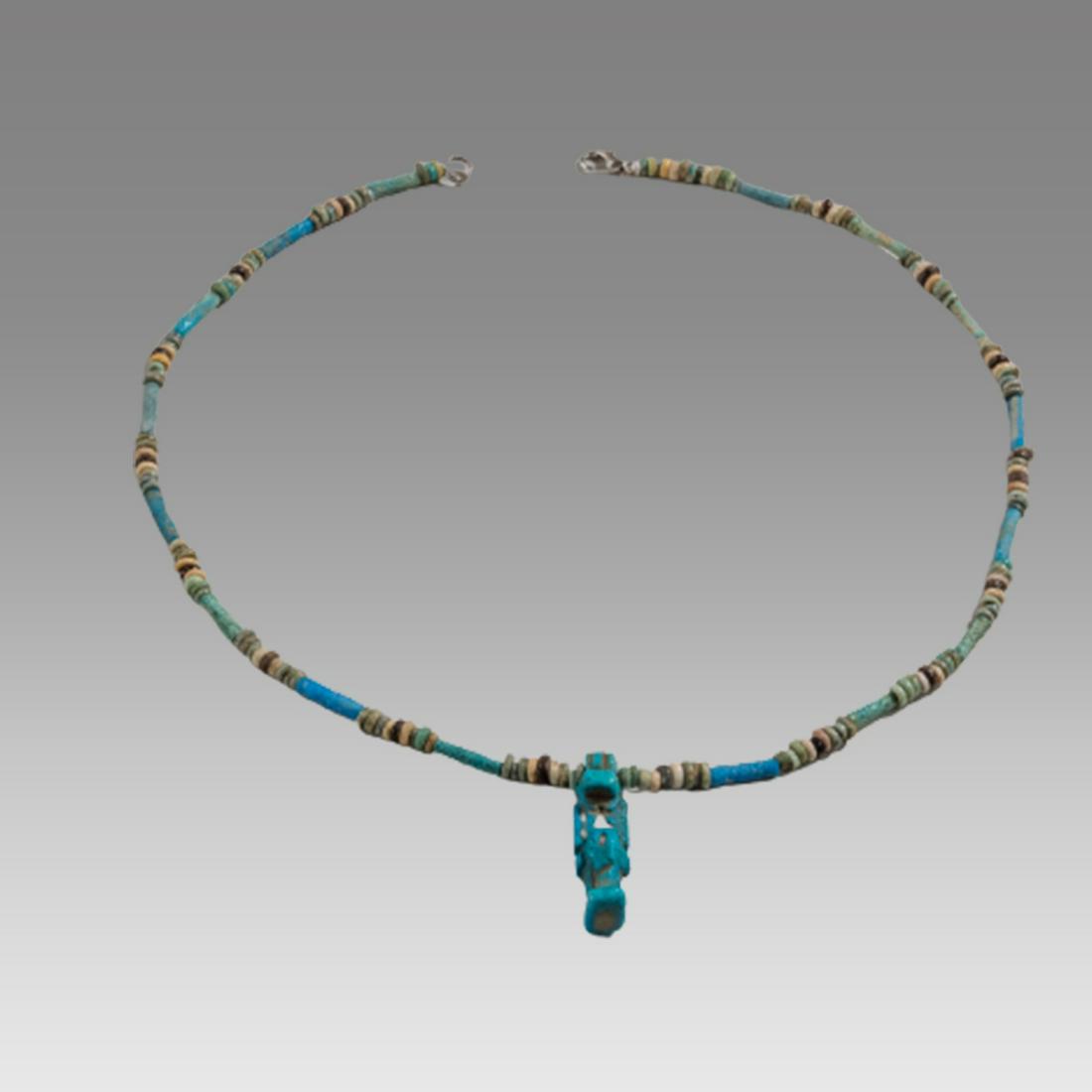 Ancient Egyptian Faience Bead Necklace, Taweret Amulet c.300-50 BC.: Ancient Egyptian Faience Bead Necklace, Taweret Amulet c.300-50 BC. Size 18 1/2 inches length. 1 1/4 inch high (amulet) Great Looking single strand Faience Bead necklace with blue faience Taweret Amul