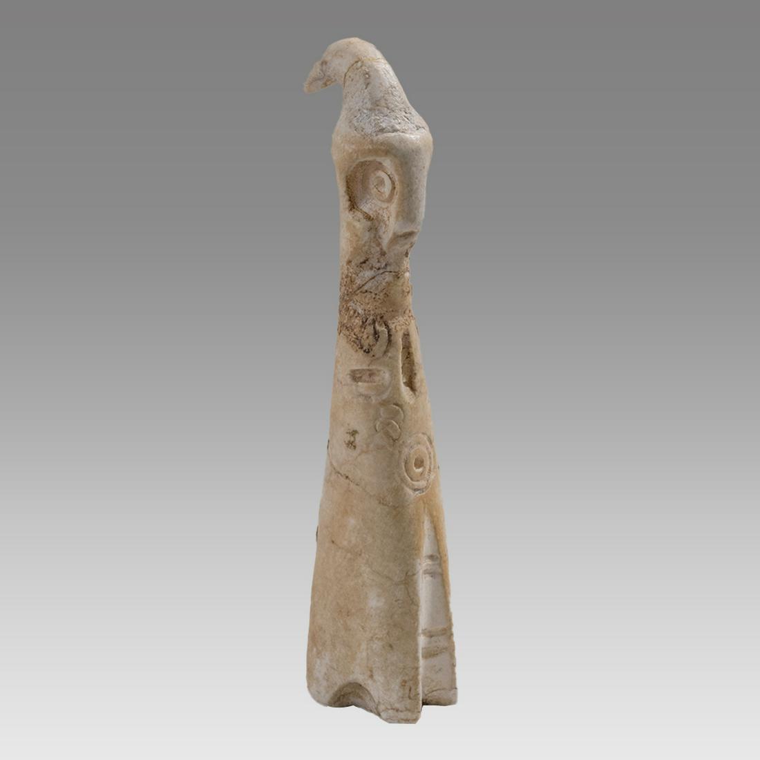 Archaeological Near Eastern shell Idol c.2000-1000 BC.: Archaeological Near Eastern shell Idol c.2000-1000 BC. Size 3 5/8 inches high. Unusual carved shell Idol wearing headdress, deep carved circle eyes with cylinderical body decorated with etched design.