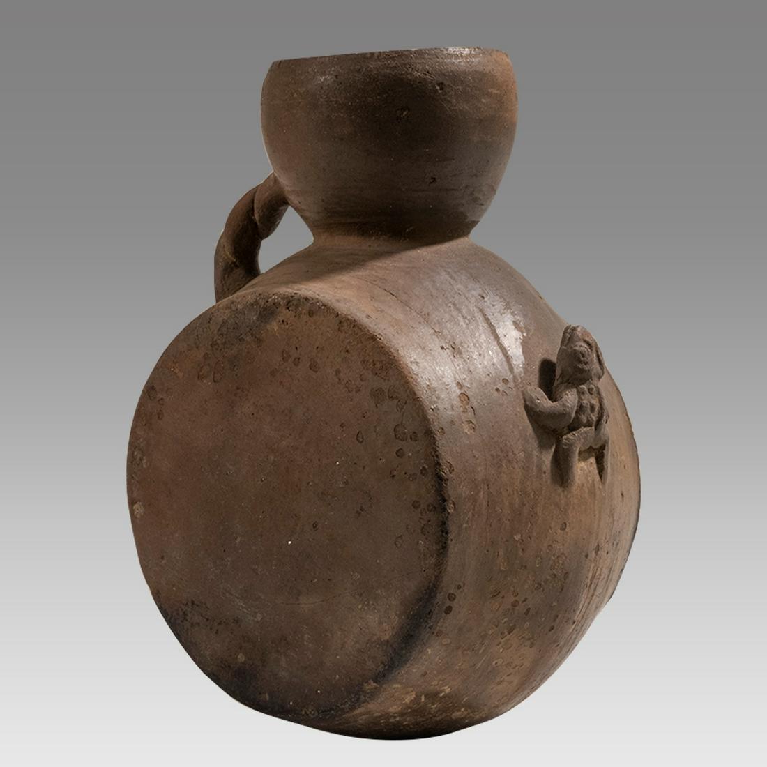Pre-Columbian, North Highlands Chavin Canteen with Frog, ca. 1200 BC to 200 BC.: Pre-Columbian, North Highlands Chavin Canteen with Frog, ca. 1200 BC to 200 BC. A barrel shaped canteen decorated in a pale brown pigment. An applied frog decoration is applied to the center body. A r