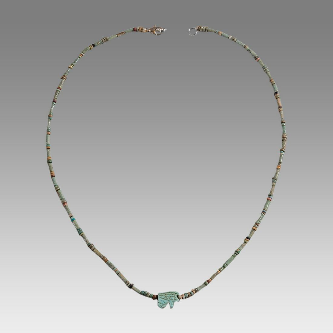 Ancient Egyptian Faience Bead Necklace c.300-50 BC.: Ancient Egyptian Faience Bead Necklace c.300-50 BC. Size 19 1/2 inches length. Great Looking single strand Faience Bead necklace with Eye of Horus Amulet, late period 300-50 BC. wearable. Provenance: 