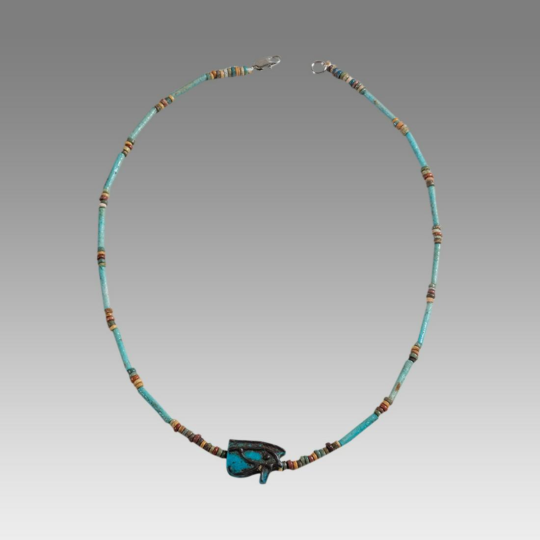 Ancient Egyptian Faience Bead Necklace c.300-50 BC.: Ancient Egyptian Faience Bead Necklace c.300-50 BC. Size 17 1/4 inches length. Great Looking single strand Faience Bead necklace with Eye of Horus Amulet, late period 300-50 BC. wearable. Provenance: 