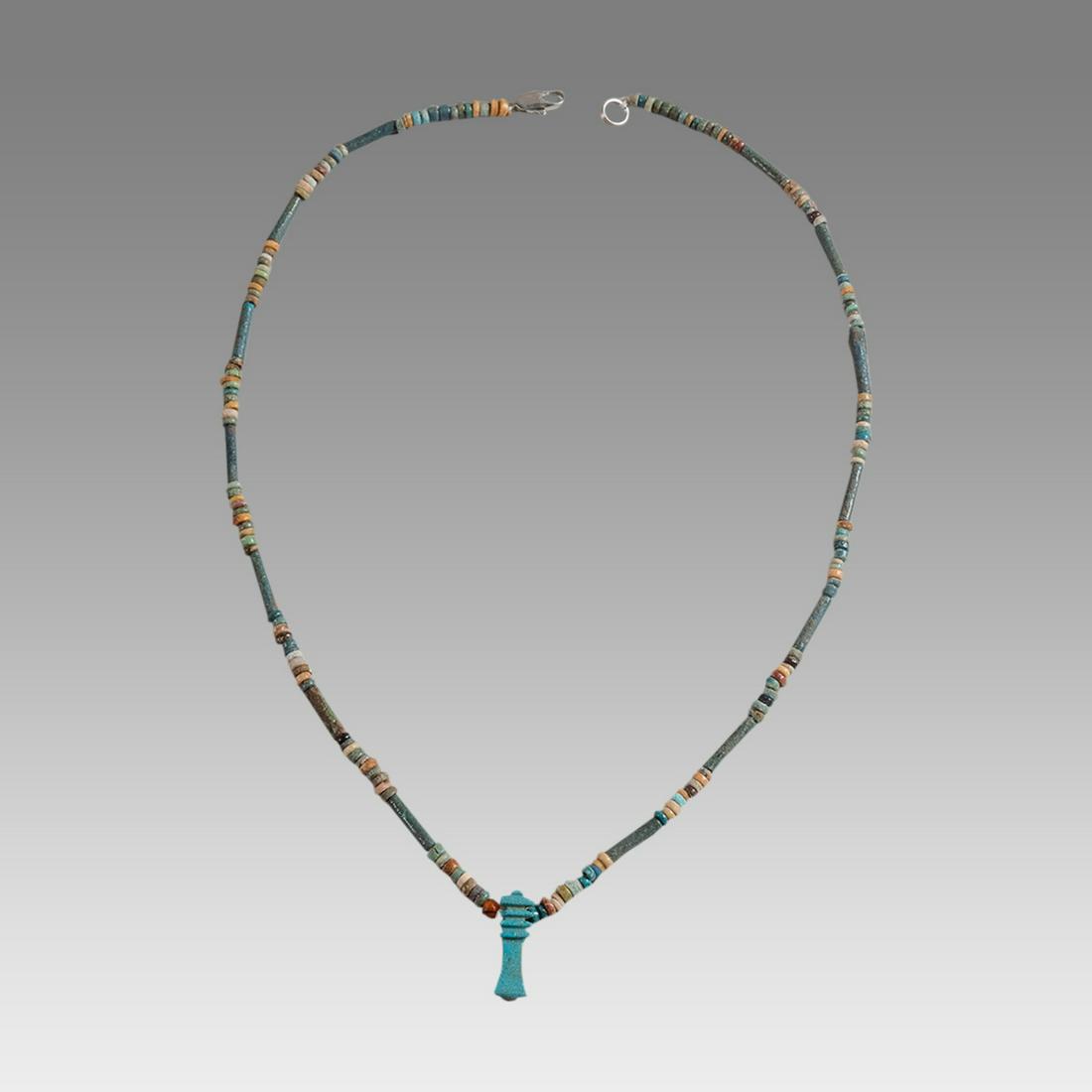 Ancient Egyptian Faience Bead Necklace c.300-50 BC.: Ancient Egyptian Faience Bead Necklace c.300-50 BC. Size 18 1/4 inches length. Great Looking single strand Faience Bead necklace with Djed Pillar Amulet, late period 300-50 BC. wearable. Provenance: E