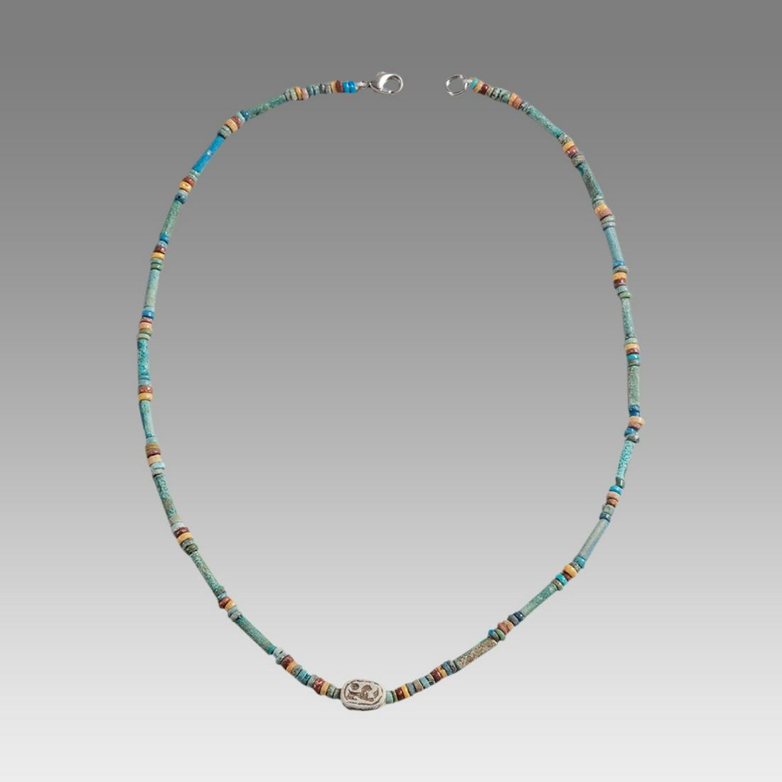 Ancient Egyptian Faience Bead Necklace c.300-50 BC.: Ancient Egyptian Faience Bead Necklace c.300-50 BC. Size 17 3/8 inches length. Great Looking single strand Faience Bead necklace with Steatite stone scarab. wearable. Provenance: Ex Secret Eyes Galler