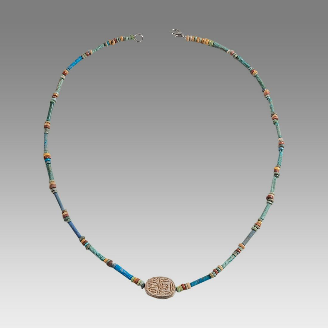 Ancient Egyptian Faience Bead Necklace c.300-50 BC.: Ancient Egyptian Faience Bead Necklace c.300-50 BC. Size 19 inches length. Great Looking single strand Faience Bead necklace with Steatite stone scarab. wearable. Provenance: Ex Secret Eyes Gallery Ne