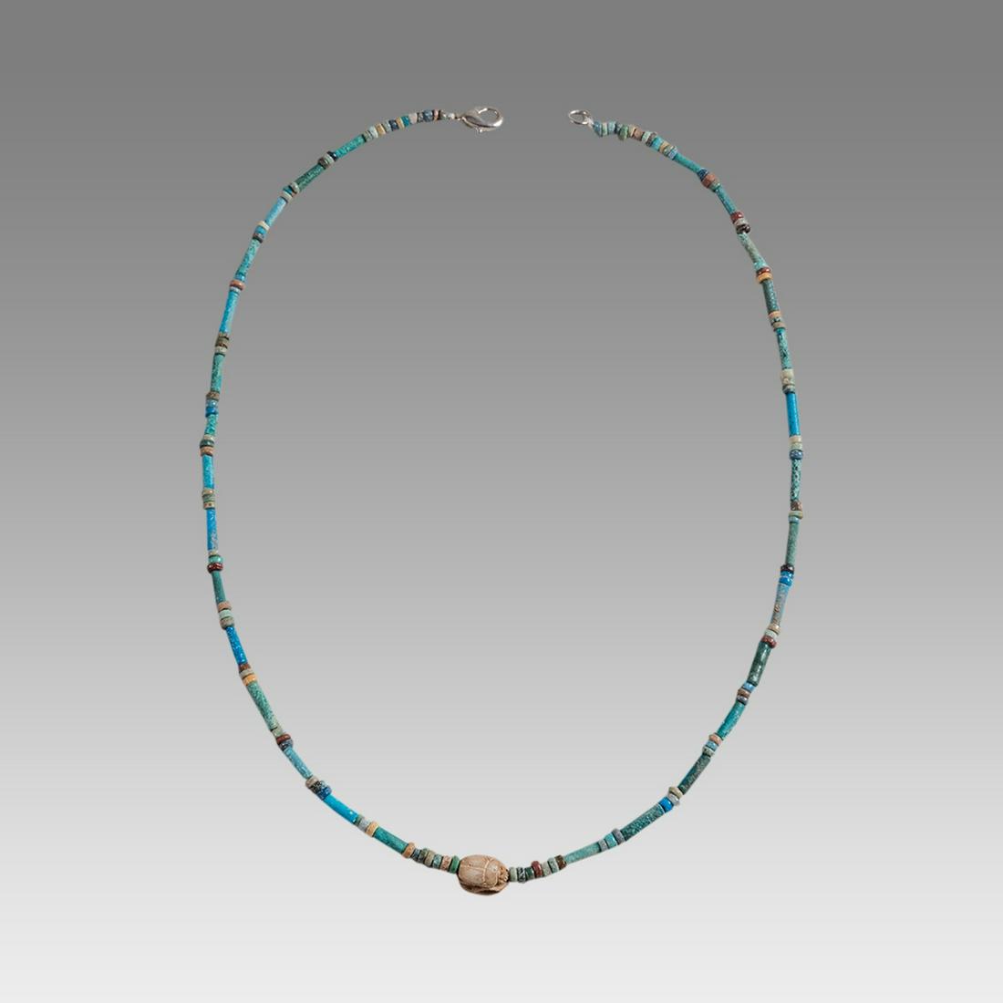 Ancient Egyptian Faience Bead Necklace c.300-50 BC.: Ancient Egyptian Faience Bead Necklace c.300-50 BC. Size 18 1/4 inches length. Great Looking single strand Faience Bead necklace with Steatite stone scarab. wearable. Provenance: Ex Secret Eyes Galler