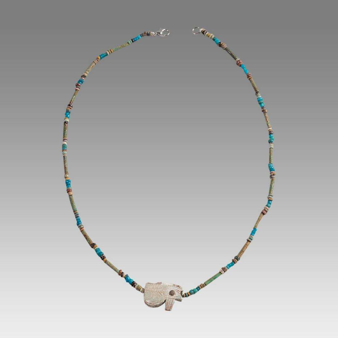 Ancient Egyptian Faience Bead Necklace c.300-50 BC.: Ancient Egyptian Faience Bead Necklace c.300-50 BC. Size 19 inches length. Great Looking single strand Faience Bead necklace with Eye of Horus Amulet, late period 300-50 BC. wearable. Provenance: Ex S