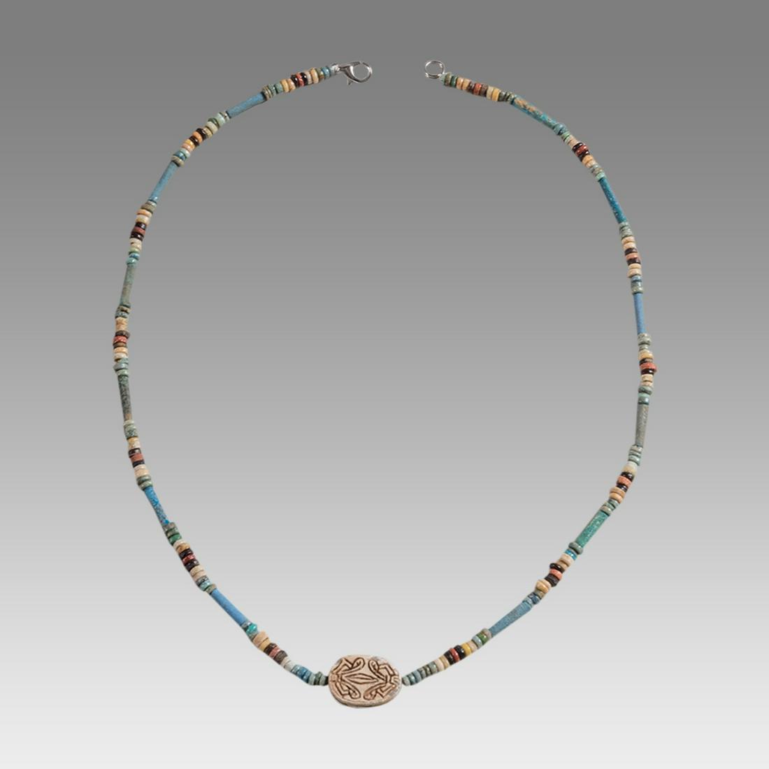 Ancient Egyptian Faience Bead Necklace c.300-50 BC.: Ancient Egyptian Faience Bead Necklace c.300-50 BC. Size 18 3/4 inches length. Great Looking single strand Faience Bead necklace with Steatite stone scarab. wearable. Provenance: Ex Secret Eyes Galler