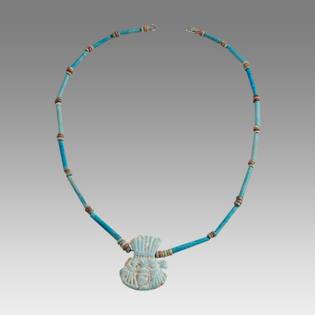 Ancient Egyptian Faience Bead Necklace c.300-50 BC.: Ancient Egyptian Faience Bead Necklace c.300-50 BC. Size 19 3/4 inches length. Great Looking single strand Faience Bead necklace with Faience Bes amulet. wearable. Provenance: Ex Secret Eyes Gallery N