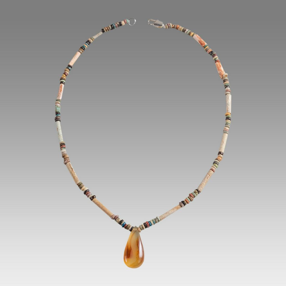 Ancient Egyptian Faience Bead Necklace c.300-50 BC.: Ancient Egyptian Faience Bead Necklace c.300-50 BC. Size 18 inches length. Great Looking single strand Faience Bead necklace with Agate bead. wearable. Provenance: Ex Secret Eyes Gallery New York 1970