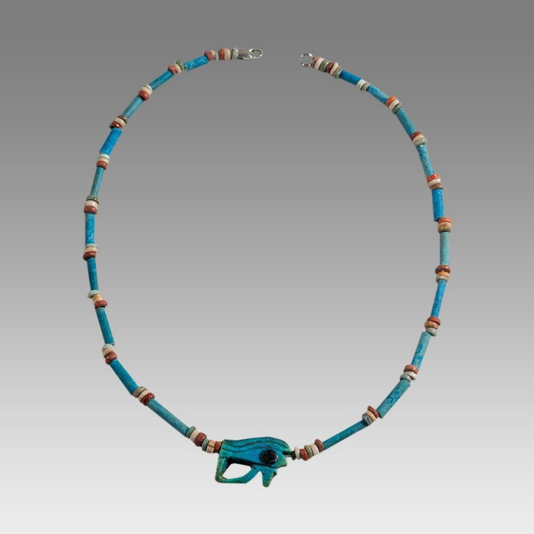 Ancient Egyptian Faience Bead Necklace c.300-50 BC.: Ancient Egyptian Faience Bead Necklace c.300-50 BC. Size 18 1/4 inches length. Great Looking single strand Faience Bead necklace with Eye of Horus Amulet, late period 300-50 BC. wearable. Provenance: 