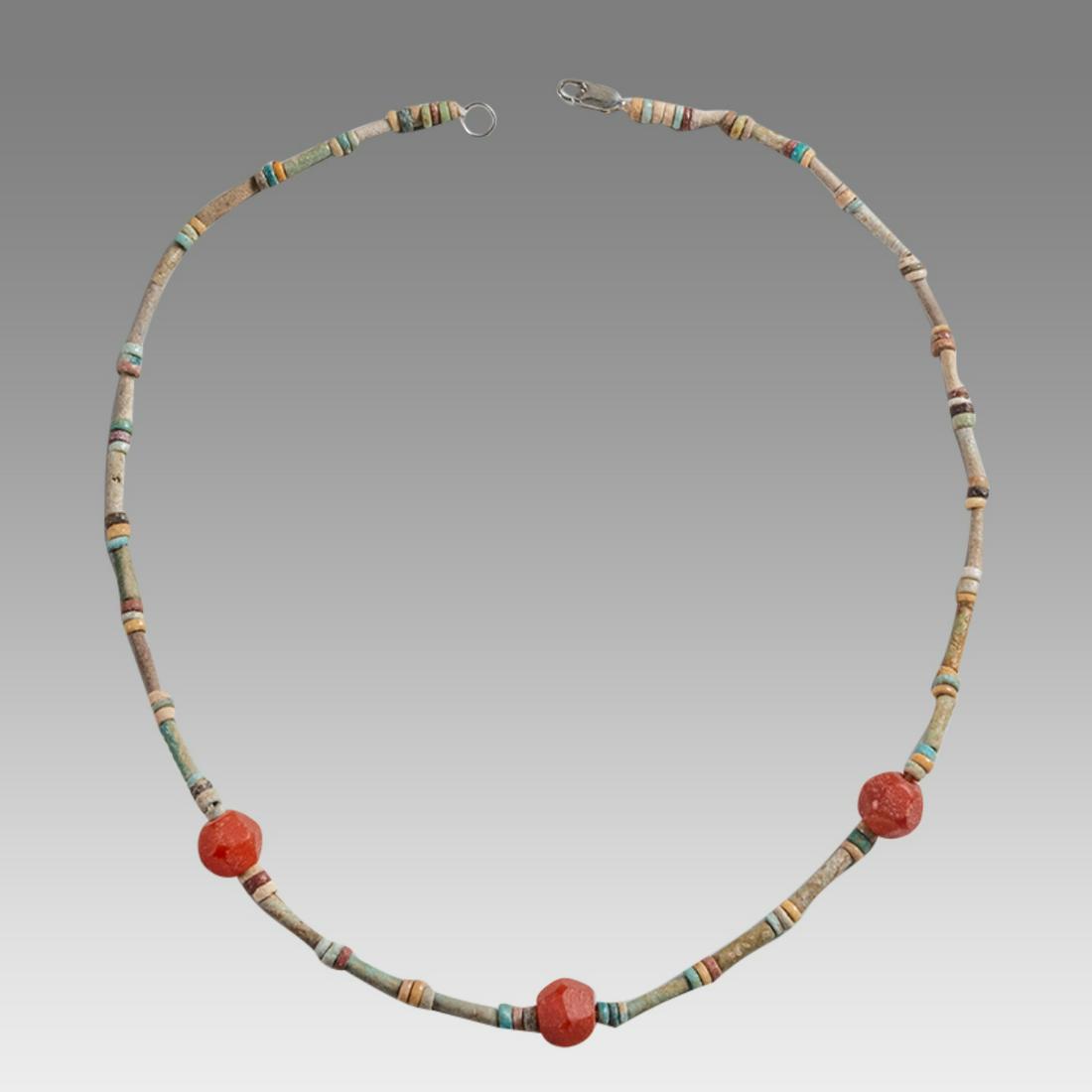 Ancient Egyptian Faience Bead Necklace c.300-50 BC.: Ancient Egyptian Faience Bead Necklace c.300-50 BC. Size 18 inches length. Great Looking single strand Faience Bead necklace. mixed with red stone beads. wearable. Provenance: Ex Secret Eyes Gallery N