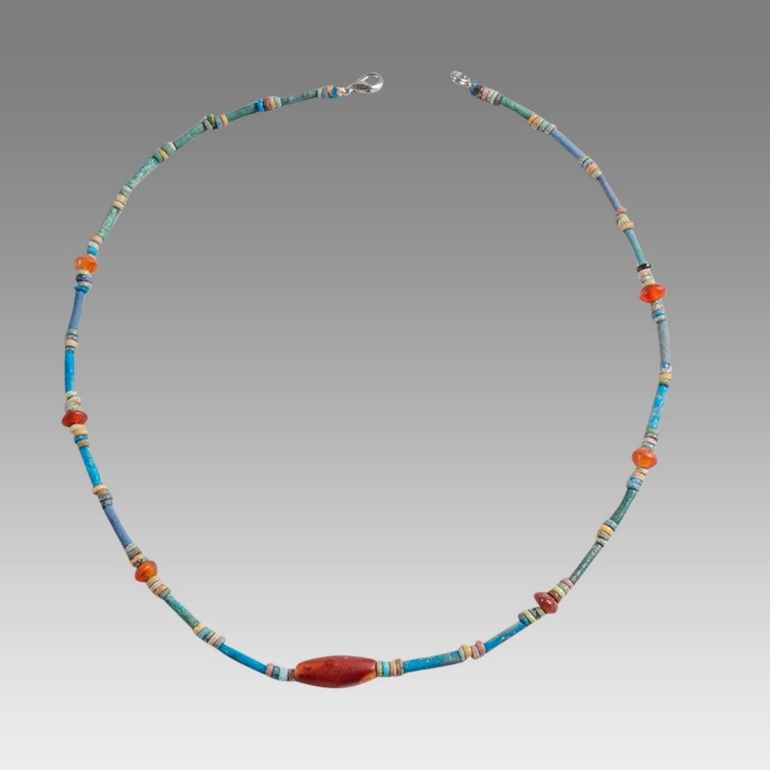 Ancient Egyptian Faience Bead Necklace c.300-50 BC.: Ancient Egyptian Faience Bead Necklace c.300-50 BC. Size 19 1/4 inches length. Great Looking single strand Faience Bead necklace. mixed with red Agate beads. wearable. Provenance: Ex Secret Eyes Galle