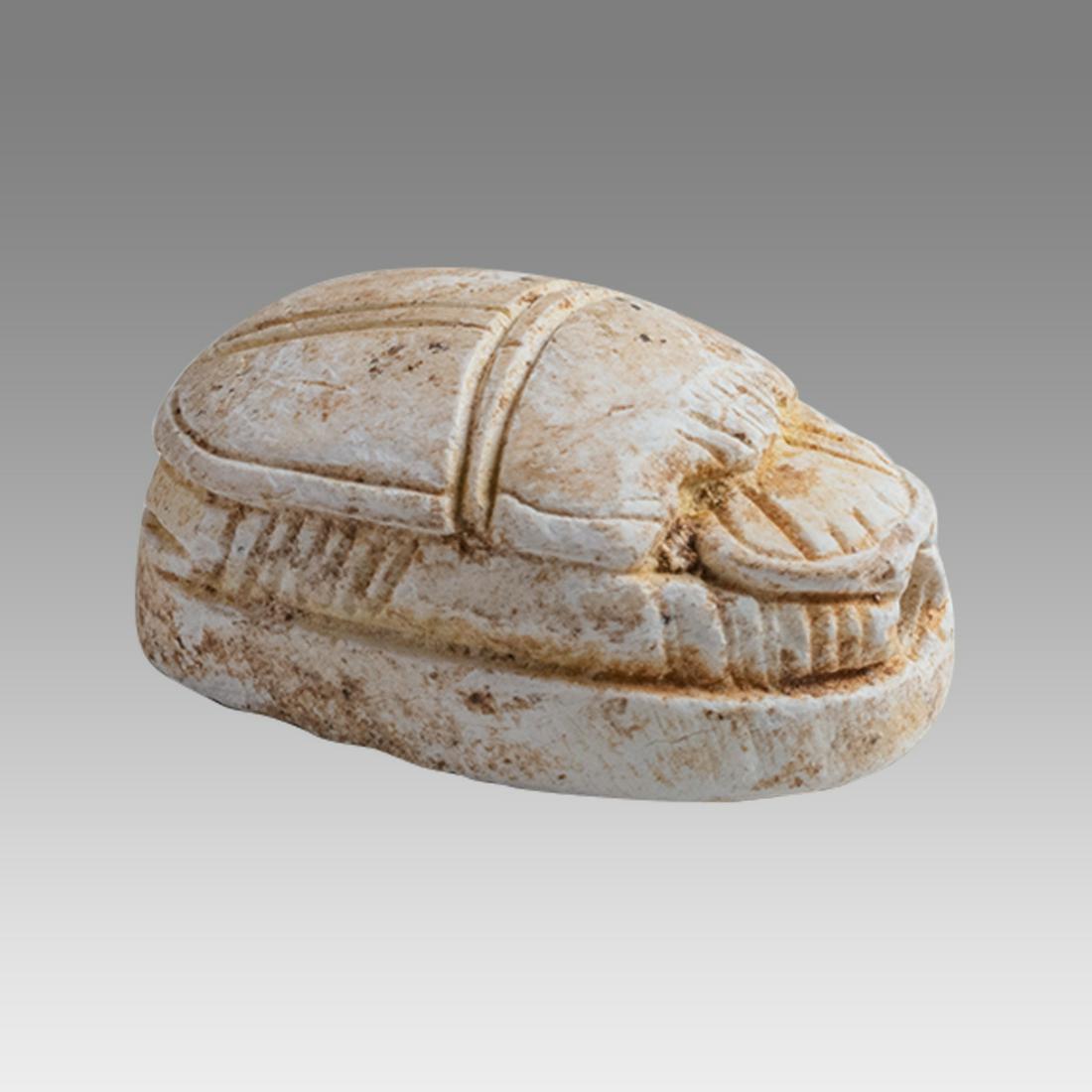 Ancient Egyptian Steatite stone Scarab c.1500-1100 BCE.: Ancient Egyptian Steatite stone Scarab c.1500-1100 BCE. Size 17 x 12 mm. Glazed steatite scarab New Kingdom with stealized beatle back. Provenance: Ex Secret Eyes Gallery New York 1970's-1980's.