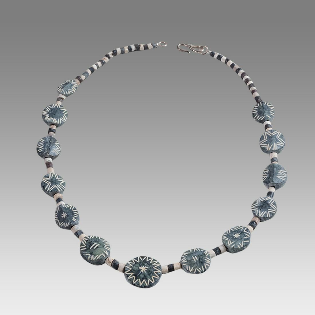 Near Eastern Black and White Bead Necklace c.3000 BC.: Near Eastern Black and White Bead Necklace c.3000 BC. Size 19 1/4 inches length. Size of beads 4-20 mm. Sumerian black and white stone Beads mixed with Islamic Glass of round shape decorated with orna