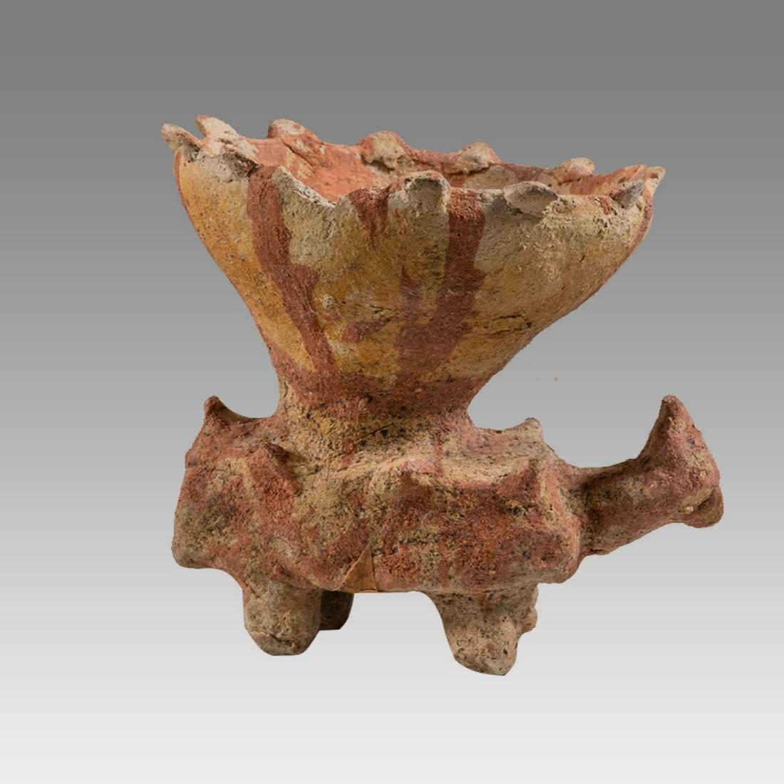 Jalisco Zoomorph Jalisco, Mexico. Ca. 100 B.C.-250 A.D.: Jalisco Zoomorph Jalisco, Mexico. Ca. 100 B.C.-250 A.D. Size 5 1/8 inches high. Jalisco animal with a large bowl in the center of his back, having a multi-spike rim, painted pinkish-orange decoration.