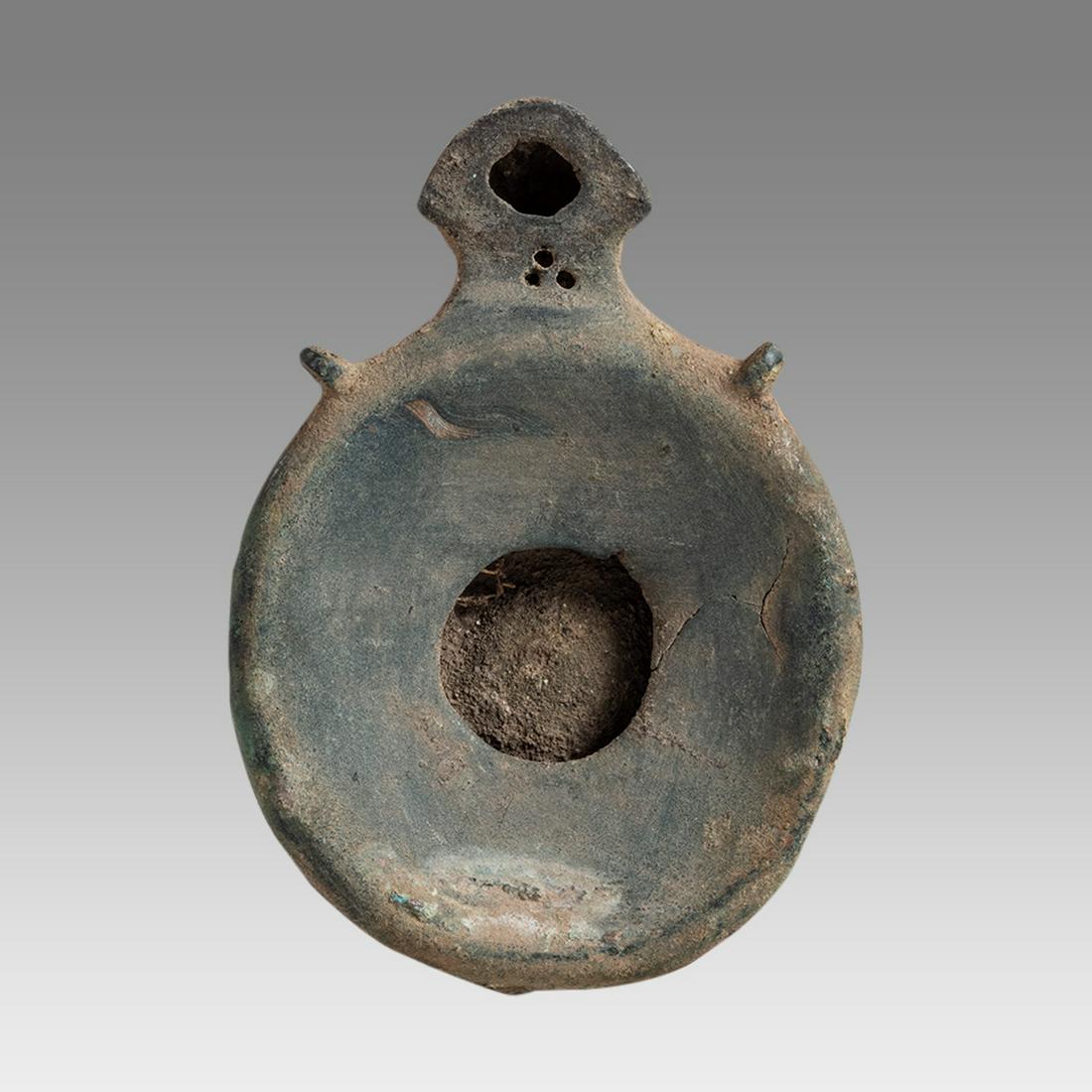 Ancient Roman Bronze Oil Lamp c.1st-4th century AD.: Ancient Roman Bronze Oil Lamp c.1st-4th century AD. Size 4 1/4 inches length x 0 7/8 inches high. Fine Ancient Roman Empire Bronze oil lamp with choice patina. Originaly had a handle now missing. Prov