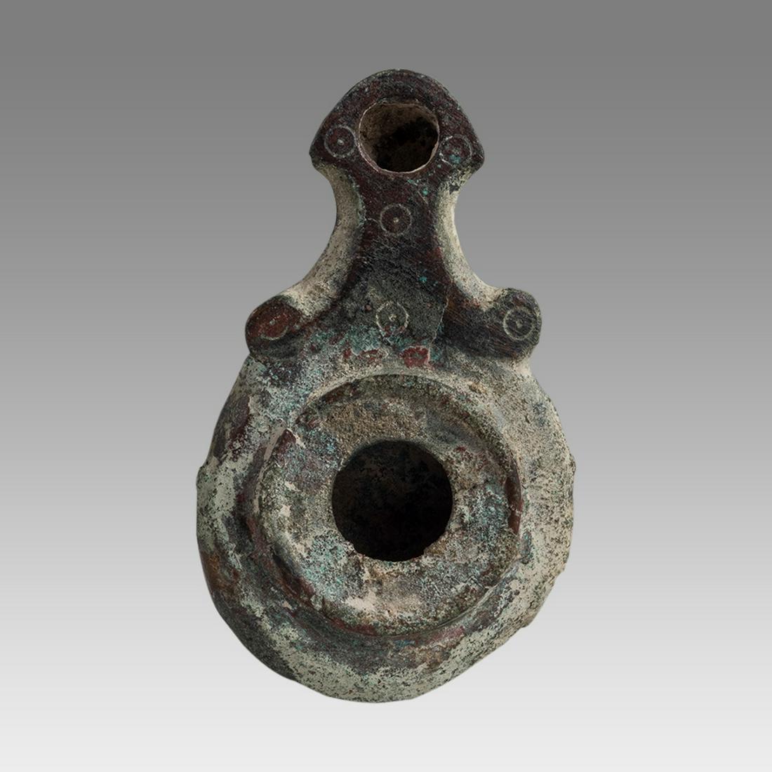Ancient Roman Bronze Oil Lamp c.1st-4th century AD.: Ancient Roman Bronze Oil Lamp c.1st-4th century AD. Size 3 1/2 inches length x 0 7/8 inches high. Ancient small Roman Empire Bronze oil lamp with incrustation patina. Provenance: From the Estate of Ro