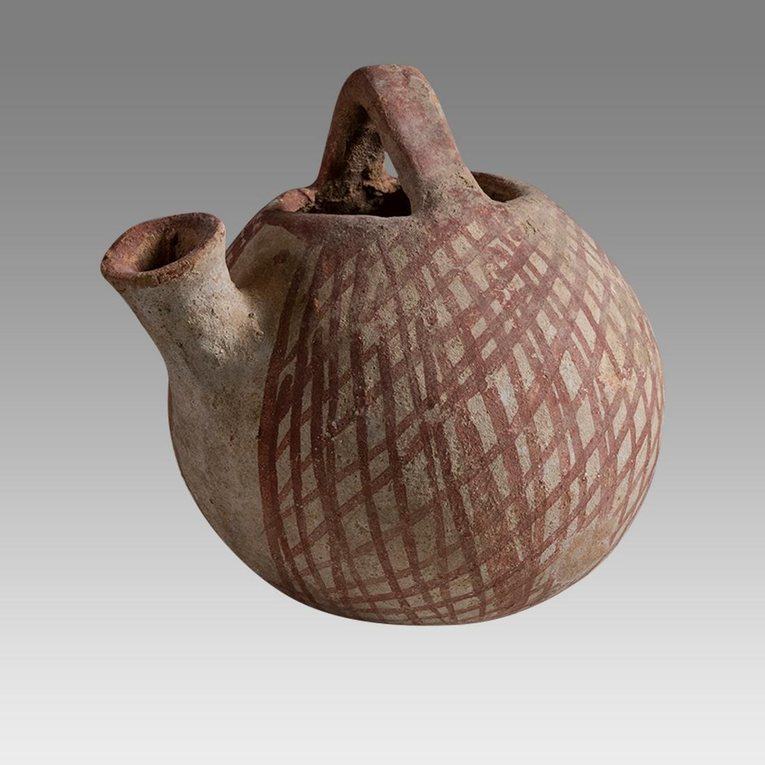 Ancient Holy Land Bronze Age Terracotta Vessel c.1400 BC.: Ancient Holy Land Bronze Age Terracotta Vessel c.2000 BC. Size 4 1/2 inches high, 5 inches diameter. Rare form Ancient Holy land Bronze age Terracotta Vessel with handle and spout, decorated with geom