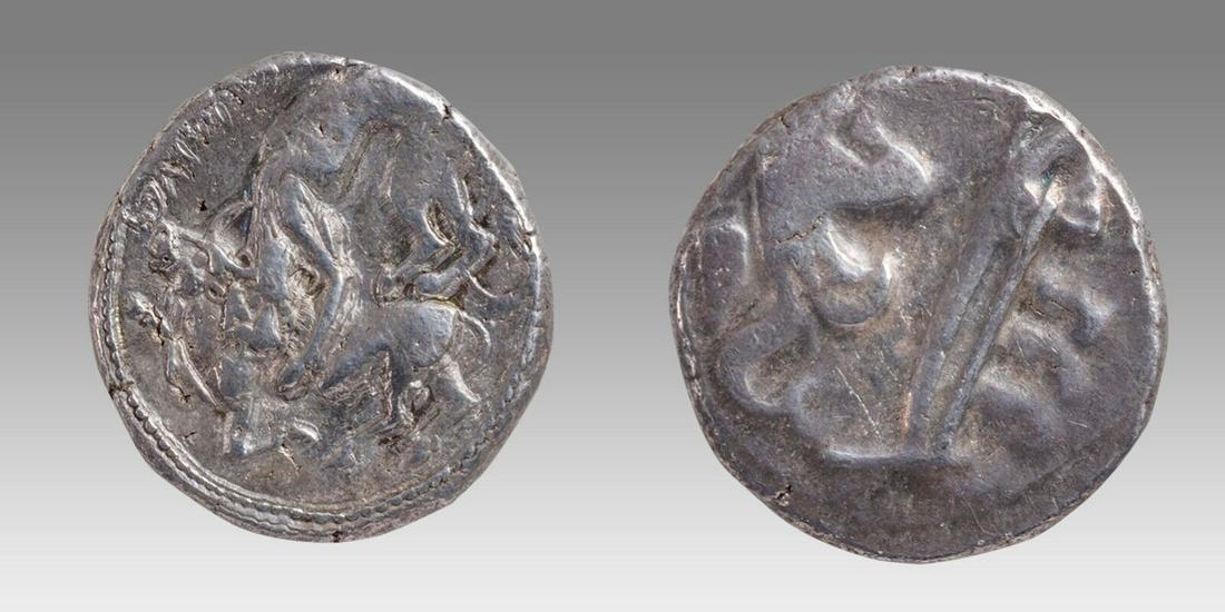 PHOENICIA, Byblos (Gebal). 'Ozba'al. Circa 400-365 BC. AR Shekel (24mm, 13.16 g,: PHOENICIA, Byblos (Gebal). 'Ozba'al. Circa 400-365 BC. AR Shekel (24mm, 13.16 g, 2h). Three hoplites on galley left above waves; below, hippocamp left above murex shell / Lion attacking bull left. E&E