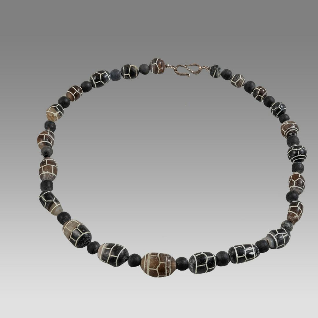 A Tibetian Style Agate Bead Necklace.: A Tibetian Style Agate Bead Necklace. Size 19 1/4 inches length. Size of beads 7-19 mm. Fine single strand Agate beads with decoration. wearable. Provenance: Ex Pegasi Numismatics MI.