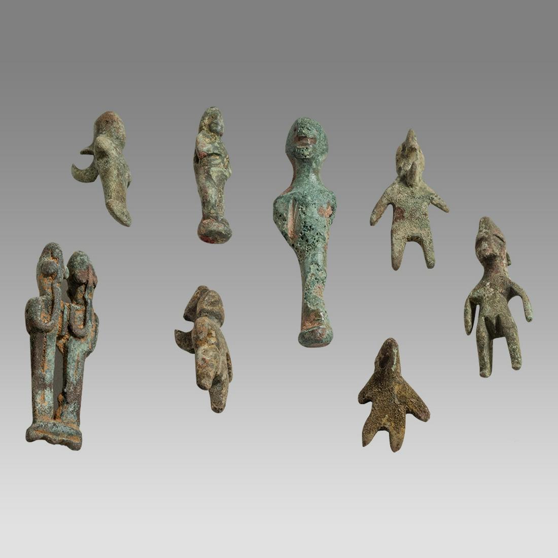 Lot of 8 Ancient Canaanite Bronze Idols c.2000 BC.: Lot of 8 Ancient Canaanite Bronze Idols c.2000 BC. Size 0 7/8 - 1 7/8 inches high. Fine collection of 8 ancient bronze standing idols, a couple with suspension loop at back. Provenance: From Private N