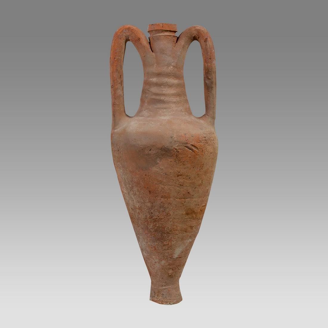 Ancient Holy Land Hellenistic Terracotta Wine Amphora c.100 BC.: Ancient Holy Land Hellenistic Terracotta Wine Amphora c.100 BC. Size 24 inches high, 9 inches across handles. A large terracotta wine amphora with twin handles. lovely earthern patina. Provenance: Ex 